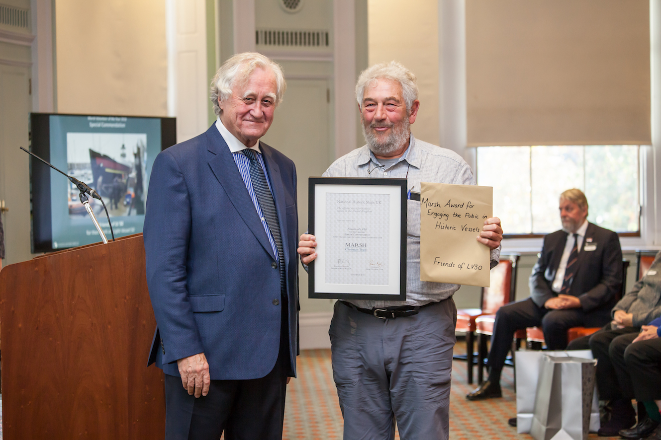 Lester Sher of Friends of LV50 receiving Marsh Award from Brian Marsh in 2018